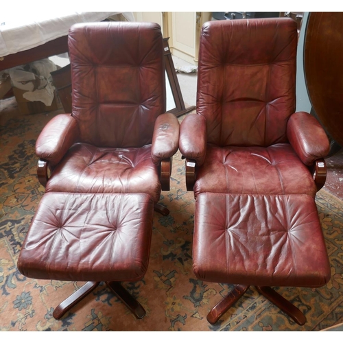 473 - Pair of leather mid century swivel recliner chairs with stools