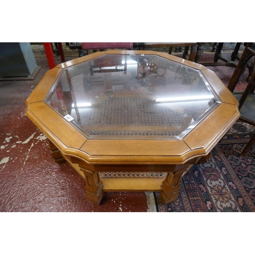 487 - Octagonal glass and bergere coffee table