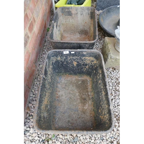 513 - Pair of cast iron troughs