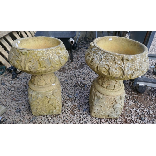 518 - Pair of round stone planters on plinths - Approx height: 65cm