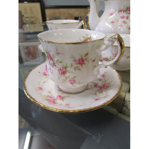 328 - Crown Staffordshire tea service together with a Paragon Victoriana Rose tea set