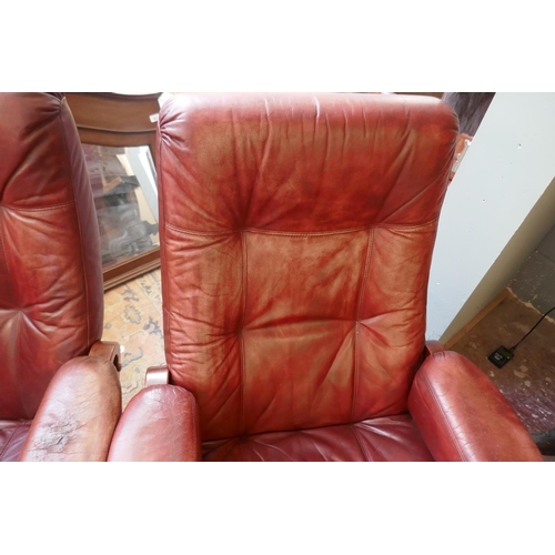 473 - Pair of leather mid century swivel recliner chairs with stools