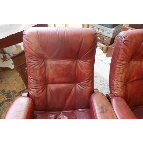 473 - Pair of leather mid century swivel recliner chairs with stools