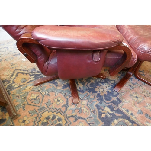 473 - Pair of leather mid century swivel recliner chairs with stools