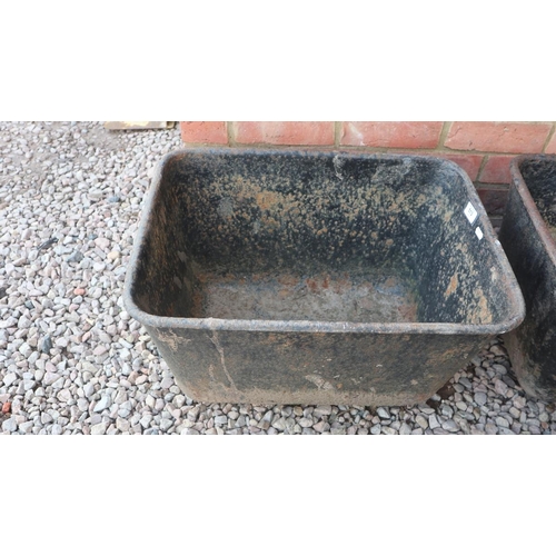 513 - Pair of cast iron troughs