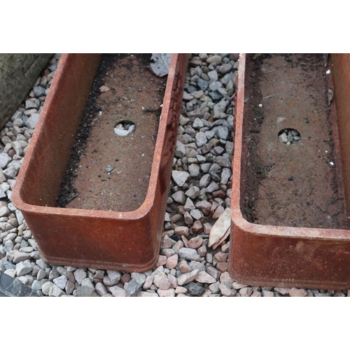 532 - Pair of cast iron trough planters