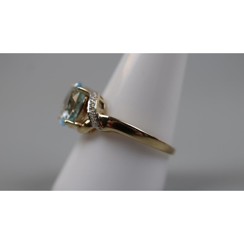 55 - 9ct gold blue topaz and diamond set ring - Size: T