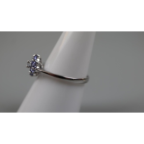 80 - 9ct white gold tanzanite and diamond set ring - Size: P