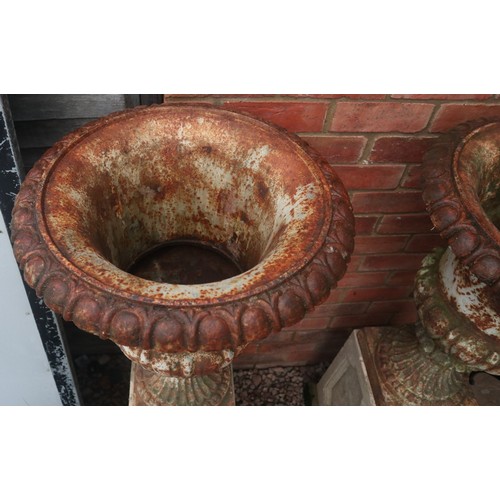 538 - Pair of Victorian cast iron planters on stone plinths - Approx height: 127cm