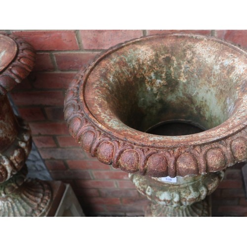 538 - Pair of Victorian cast iron planters on stone plinths - Approx height: 127cm