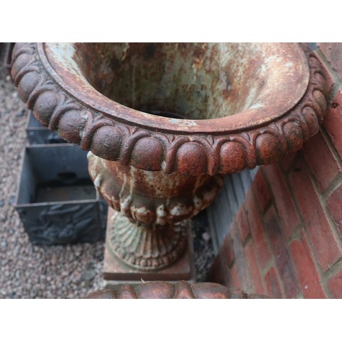 538 - Pair of Victorian cast iron planters on stone plinths - Approx height: 127cm