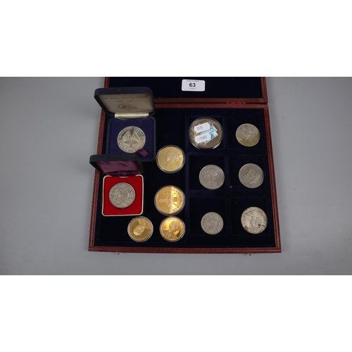 63 - Collectors coins in display case