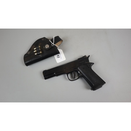 82 - Novelty lighter in form of hand gun in holster