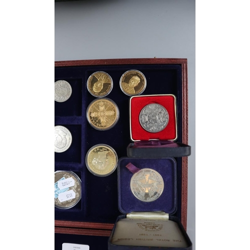 63 - Collectors coins in display case