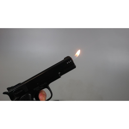 82 - Novelty lighter in form of hand gun in holster