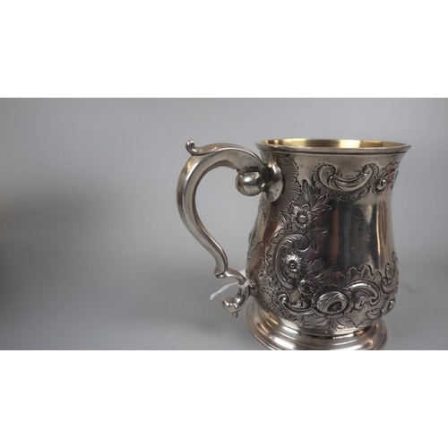 9 - Early hallmarked silver embossed tankard with London marks - Approx weight 377g