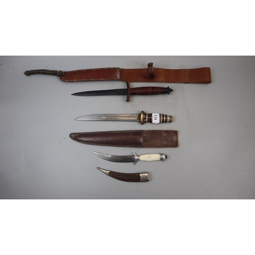 174 - 3 knives in sheaths to include fighting knife