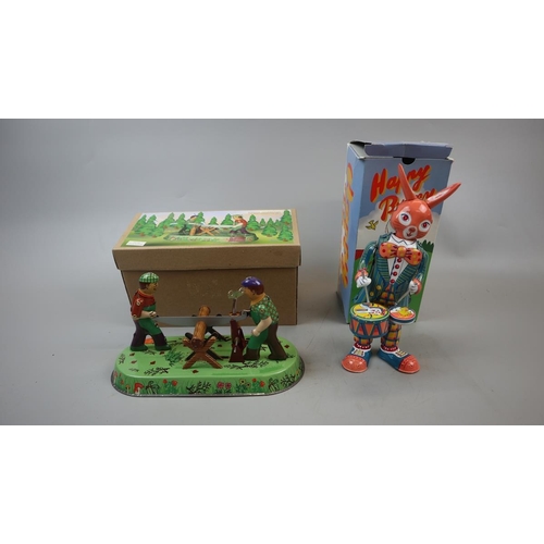 203 - 2 wind up tin plate toys