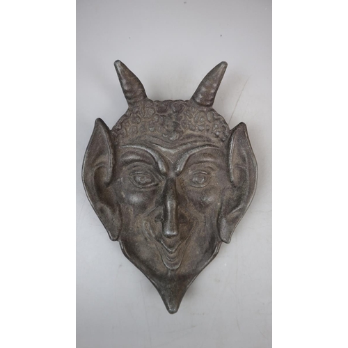 253 - Metal devil face plaque