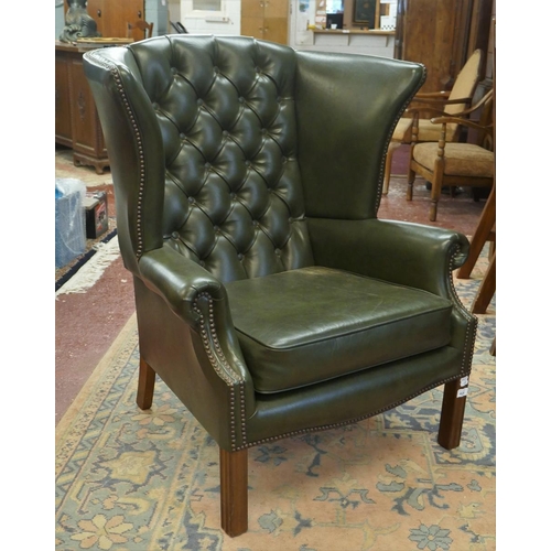 424 - Green wing-back armchair