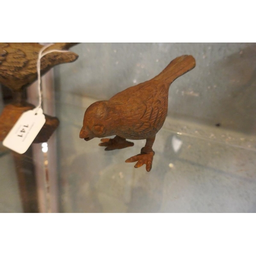 141 - 2 cast iron bird figurines