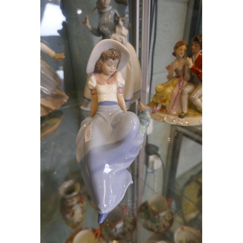 143 - Collection of figurines to include Lladro & Nao