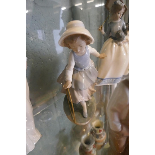 143 - Collection of figurines to include Lladro & Nao