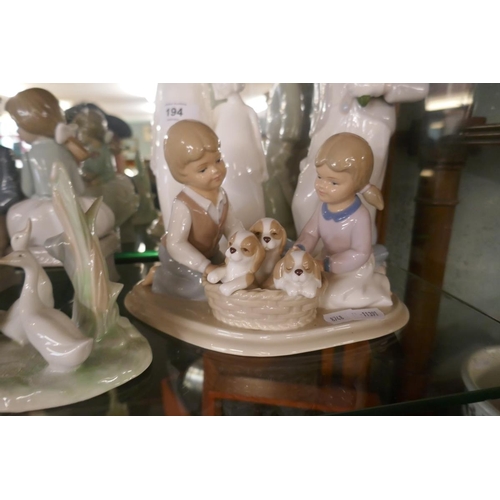 194 - Collection of Lladro figurines together with Royal Doulton sisters figurine