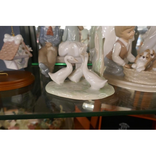 194 - Collection of Lladro figurines together with Royal Doulton sisters figurine