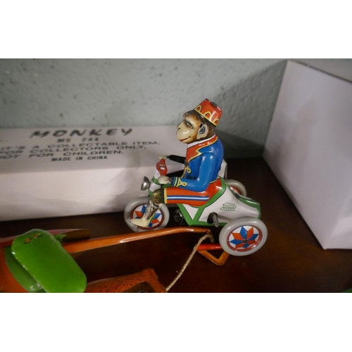 204 - 2 wind up tin plate monkey toys