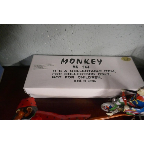 204 - 2 wind up tin plate monkey toys