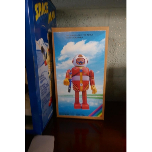 210 - 2 tin plate spaceman toys