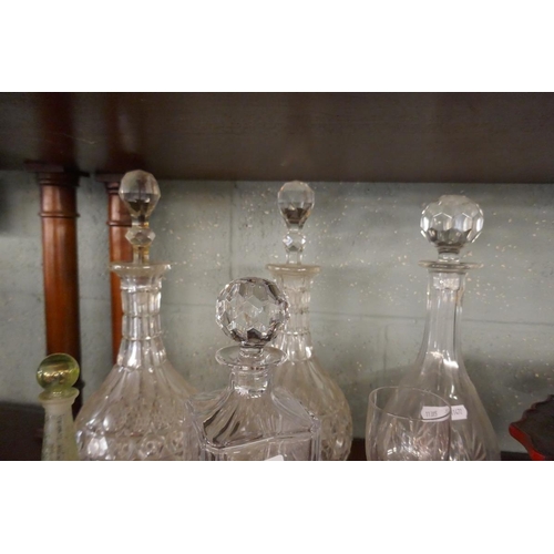 212 - Collection of cut glass decanters together with an antique perfume bottle