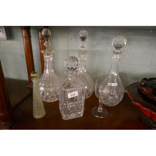 212 - Collection of cut glass decanters together with an antique perfume bottle