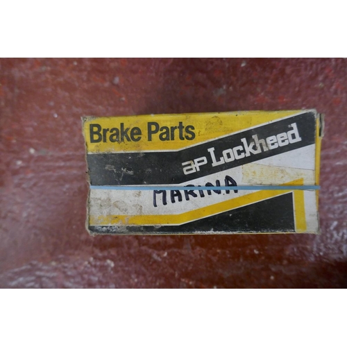 229 - Collection of automotive brake parts and a Lucas manual