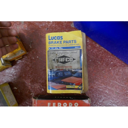 229 - Collection of automotive brake parts and a Lucas manual