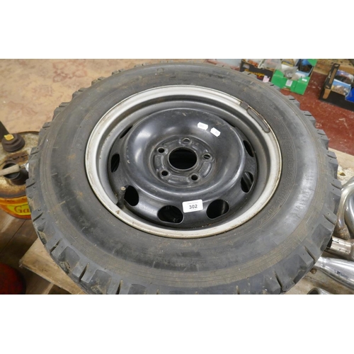 302 - Pair of unused 15 inch steel rims with 2 winter tyres