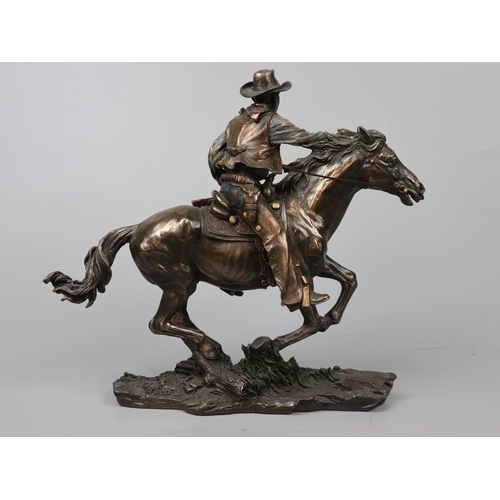 131 - Bronzed figure - John Wayne on horse - Approx height: 26cm