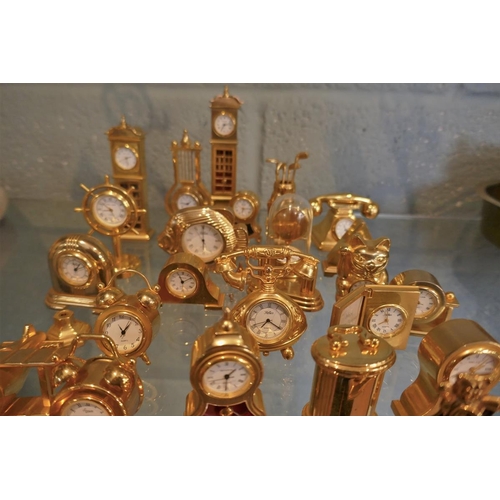 140 - Collection of miniature brass desk clocks