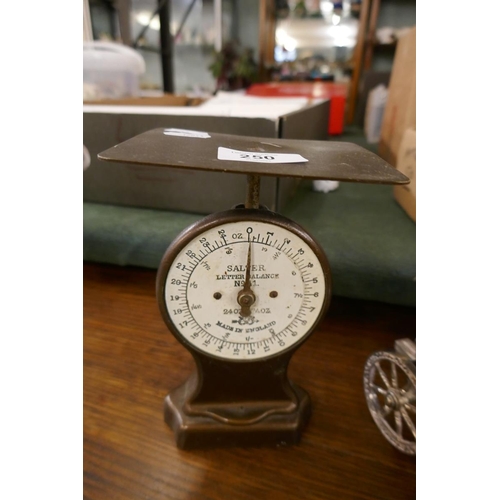 250 - Collection of metal ware to include candlesticks and Salter letter scales