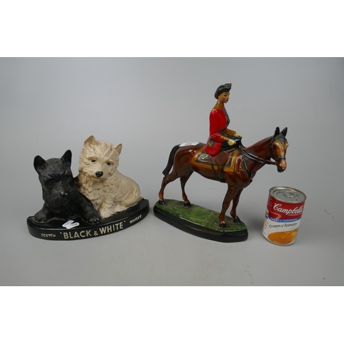 266 - Figurine of the Queen riding a horse together with a Black and White Whisky figurine