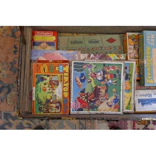 433 - Vintage travel trunk full of vintage jigsaws