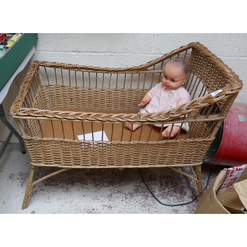 448 - Wicker cot along with doll