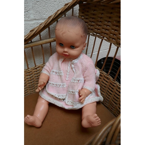 448 - Wicker cot along with doll