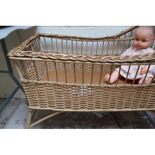 448 - Wicker cot along with doll