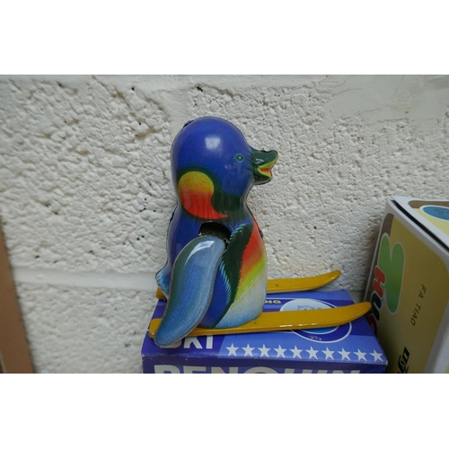 453 - Wind up tin plate toy penguin and woodpecker