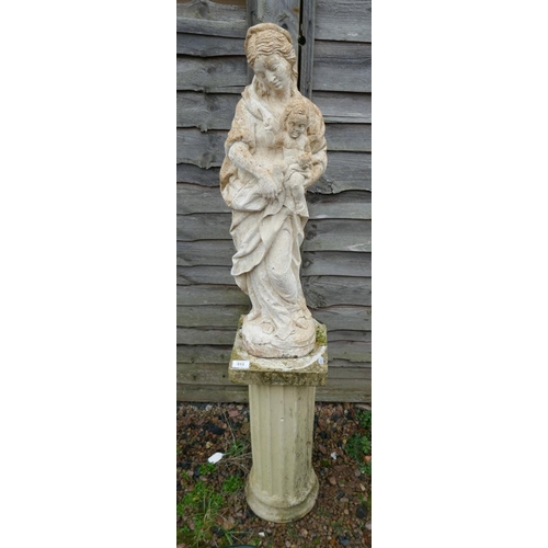 513 - Stone statue of mother and child on stone pedestal - Approx height: 129cm