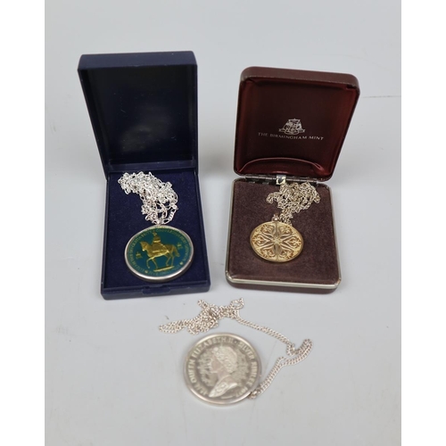 81 - 2 silver commemorative medals on chains together with another medal