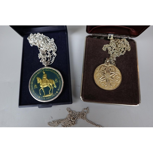 81 - 2 silver commemorative medals on chains together with another medal