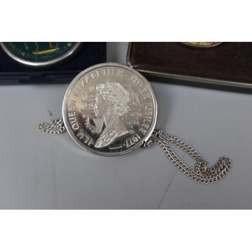 81 - 2 silver commemorative medals on chains together with another medal